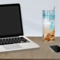 Personalized beach themed tumbler on desk beside laptop, ocean-themed workspace
